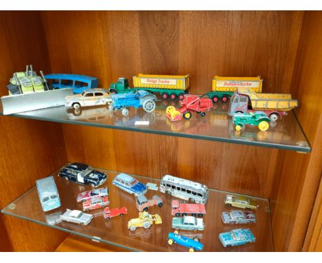 Two shelves of play worn vehicles to include Matchbox, Dinky and Corgi. 