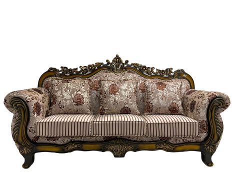 Italian Baroque design three seat sofa, hardwood framed, the cresting rail carved and pierced with c-scrolls and flower heads