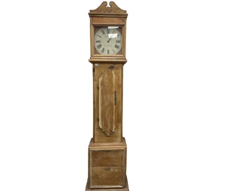 A contemporary pine cased longcase clock with a painted circular dial, Roman Numerals, and spade hands, with a battery-operat