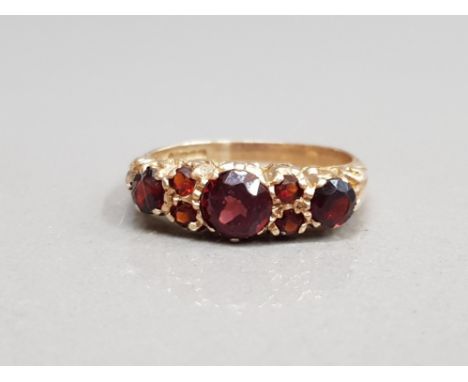 9CT YELLOW GOLD ORNATE GARNET SET RING ALL THE STONES ARE CLAW SET SIZE P1/2 3.2G GROSS