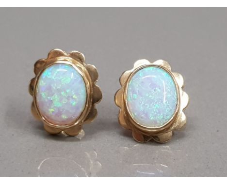 9CT YELLOW GOLD OPAL STUDS SET IN A RUB OVER SETTING WITH FANCY EDGE 2.9G GROSS