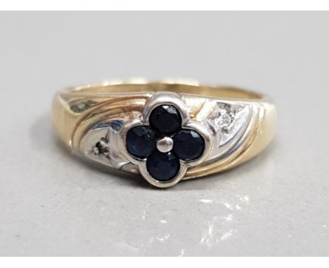 9CT YELLOW GOLD SAPPHIRE FLOWER RING COMPRISING OF FOUR ROUND CUT SAPPHIRES SET WITH A SINGLE DIAMOND ON EACH SHOULDER SIZE K