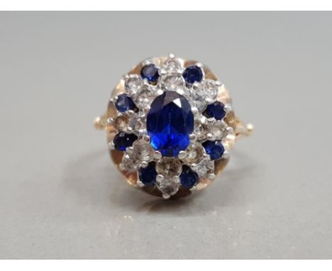 9CT YELLOW GOLD SAPPHIRE AND CUBIC ZIRCONIA CLUSTER RING FEATURING BLUE AND A WHITE STONES SET IN AN ORNATE CLUSTER SIZE K 4.