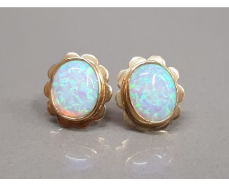 9CT YELLOW GOLD OPAL STUDS SET IN A RUB OVER SETTING 3.5G GROSS