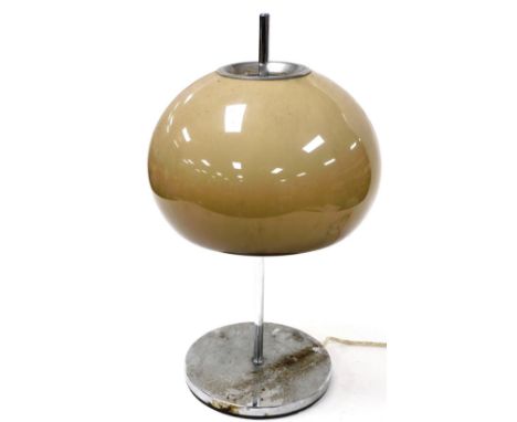 A vintage 1970's table lamp, with a mushroom coloured glass shade, on a white metal stem and circular base, 52cm high. Buyer 
