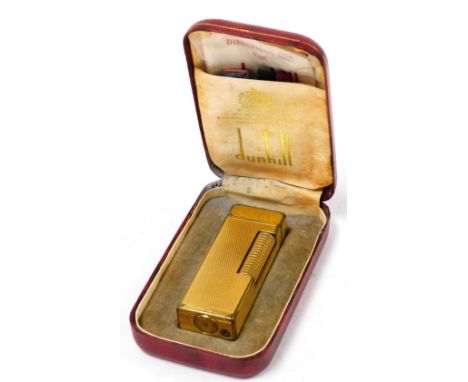 A Dunhill gold plated pocket lighter, boxed. 
