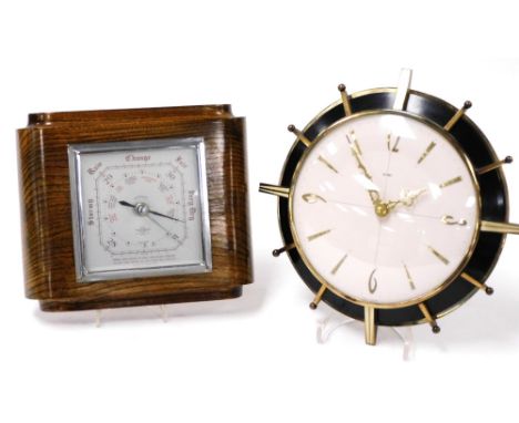 A Metamec mid century battery operated wall clock, circular white dial bearing Arabic numerals at quarters, 26cm diameter, to