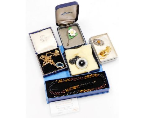 A group of costume jewellery and effects, including a ceramic posy tie pin, gold plated clasp beaded necklace, gold coloured 