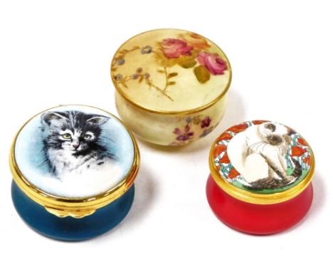 A Royal Worcester blush porcelain rouge pot and cover, painted with roses, an Ashley Enamels pot and cover, decorated with a 