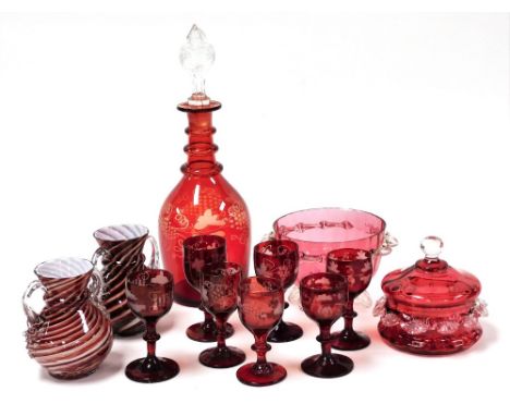 A late 19thC Continental ruby glass decanter with clear glass stopper, etched with scrolling vines, together with seven glass