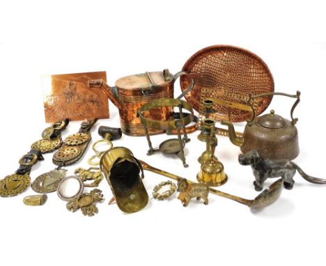 Victorian and later copper and brass ware, including horse brasses, watering can, ladle and candlesticks. (2 trays) 