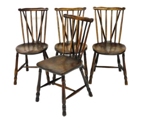 A harlequin set of 19thC oak and elm stick back kitchen chairs, three with circular seats, one with a square fronted saddle s