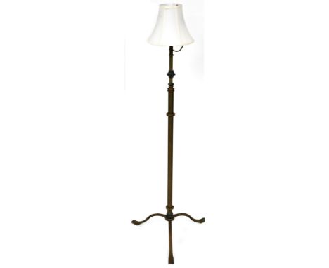 A Victorian copper and brass telescopic standard oil lamp base, converted to an electric standard lamp, with a white shade, 1