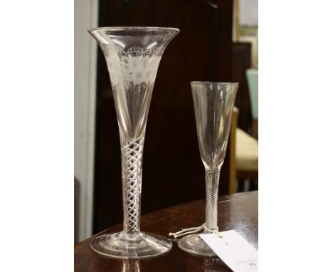 A large late 19th / early 20th century airtwist wine glass, the trumpet bowl with etched fruiting vine decoration, on a three