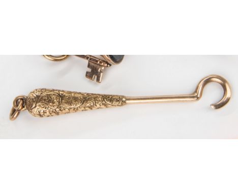 A yellow gold button hook, tear drop handle with engraved decoration, 2in. (5cm.) long.