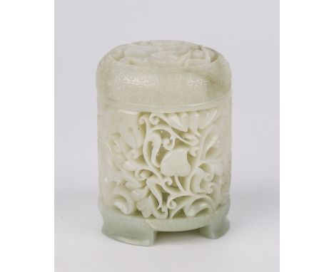 A Chinese pierced and carved pale celadon jade pot and cover, of cylindrical form, raised on three low feet, with ornate bat,