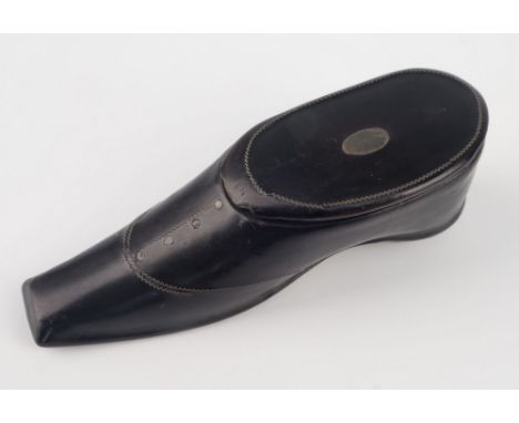 A papier-mâché shoe form vesta case or snuff box, with tapered square toe, inlaid with zig-zag wire, metal studded heel and l