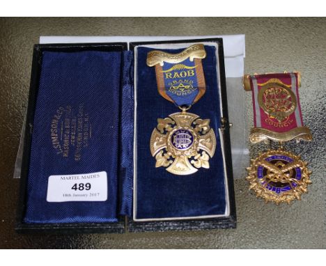 Two silver gilt R.A.O.B. breast jewels, assayed for L. Simpson London 1948, one cruciform design the arms separated by fleur 