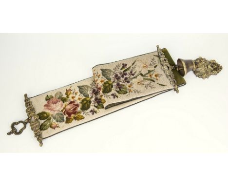 A tapestry bell pull sewn by Lone Nina Paint, with polychrome floral trail design on cream ground, brass bell and mounts, 54i