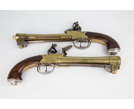 A matched pair of brass barrel and action flintlock blunderbuss pistols by Waters &amp; Co., with underside sprung bayonets m