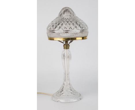 A cut glass lamp, dome form shade with graduated diamond cut design above a horizontal band of small diamond cut decoration o