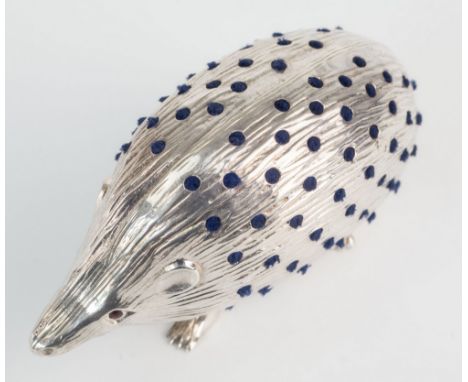 An Edwardian silver novelty form hedgehog pin cushion, Sydney & Co., Birmingham 1906, pierced hole design with secreted blue 