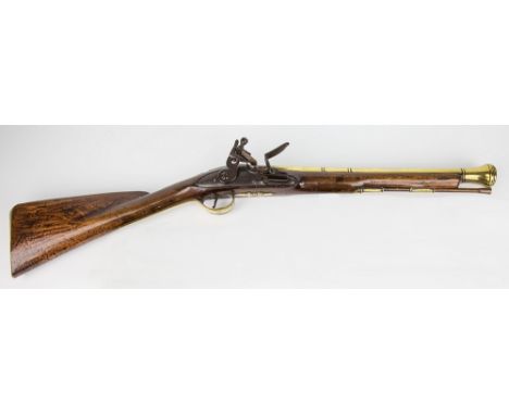 An early flintlock brass barrel blunderbuss by Turvey, c.1780, with steel lock, brass furniture with engraving and acorn fini