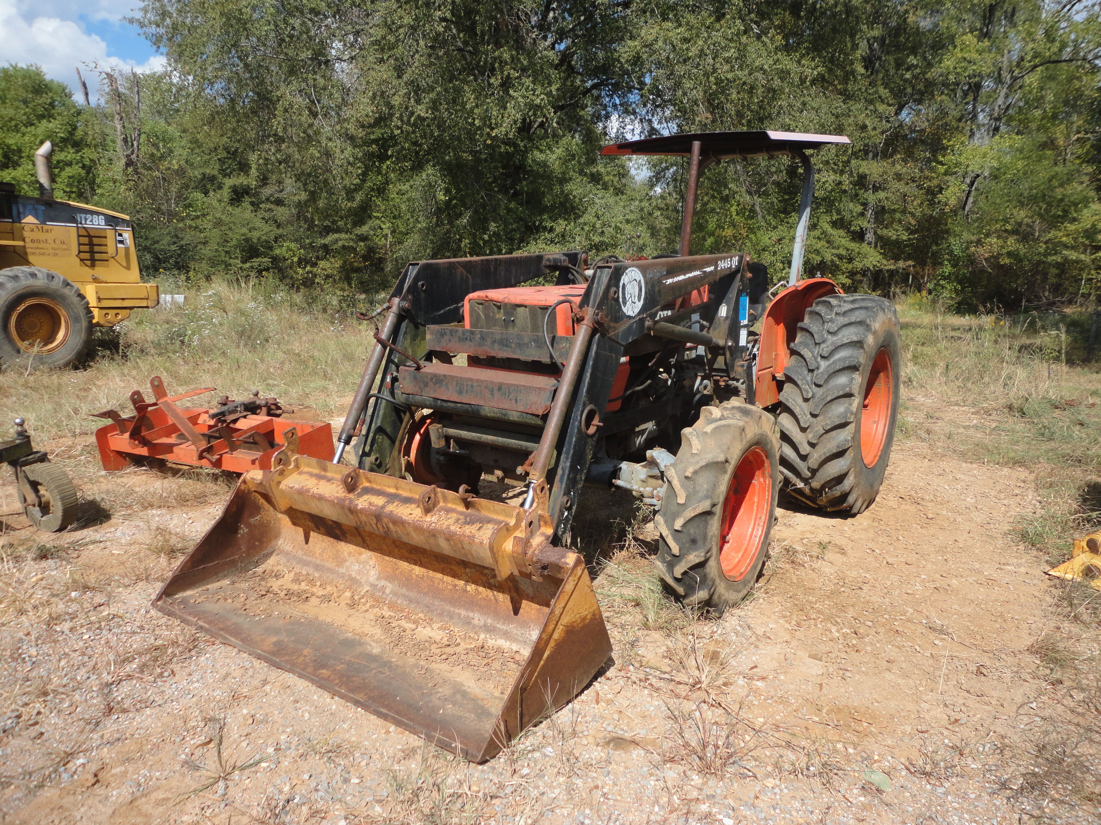 KUBOTA MODEL M5030SU FARM TYPE TRACTOR W/ BUSH HOG MODEL 2445QT FRONT