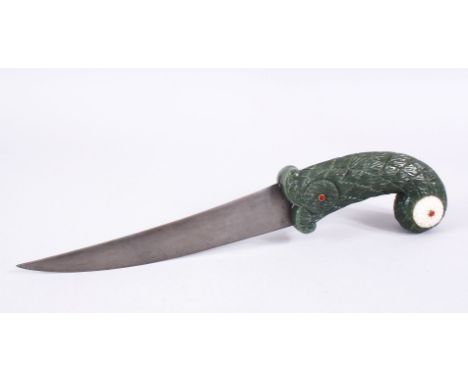 A MUGHAL INDIAN JADE HILTED WATERED STEEL DAGGER, The handle carved in floral style with inset gem like decoration, 34.5cm.