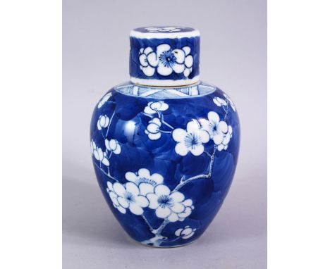 A CHINESE 18TH / 19TH CENTURY BLUE &amp; WHITE PORCELAIN GINGER JAR AND COVER, decorated with prunus decoration, the base wit