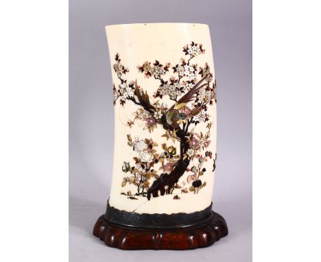 A JAPANESE MEIJI PERIOD CARVED IVORY &amp; SHIBAYAMA TUSK VASE SECTION, inlaid with semi precious stone and shells to depict 