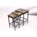 A 19TH CENTURY CHINESE LACQUER DECORATED NEST OF TABLES, decorated with views of landscapes and