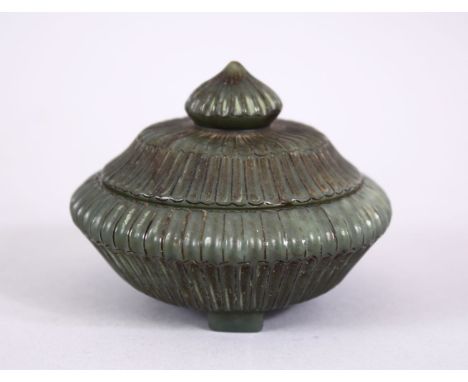 AN 18TH 19TH CENTURY MUGHAL INDIAN CARVED JADE LIDDED BOX , with a carved ribbed body, in three feet, 8cm.