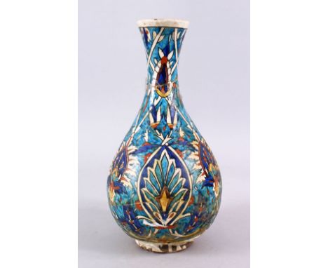 AN EARLY PERSIAN POTTERY BOTTLE VASE, with formal floral motif, 30cm, (AF)