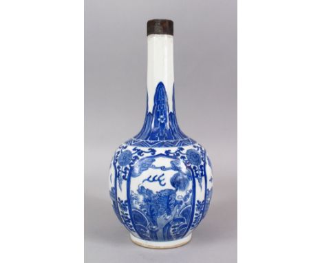 A GOOD CHINESE BLUE &amp; WHITE PORCELAIN BOTTLE VASE, with panels of native flora and lion dogs, around formal native floral