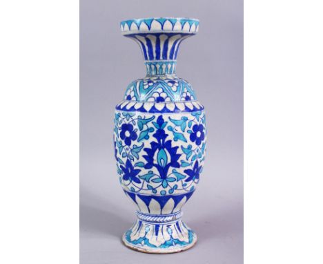 A 19TH CENTURY ISLAMIC BLUE , TURQUOISE AND WHITE POTTERY MULTAN VASE, decorated with blue formal scrolling lotus, 32cm high