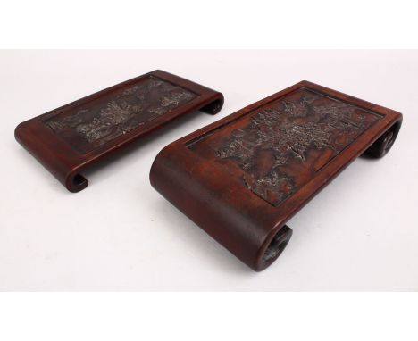 TWO 19TH CENTURY CHINESE CARVED HARD WOOD STANDS, both stands carved depicting native landscape scenes, both of scroll end fo