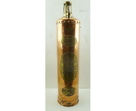 A "WATERLOO" FIRE EXTINGUISHER, the riveted copper cylinder with embossed brass panels, "type BB2" with chained brass cover a