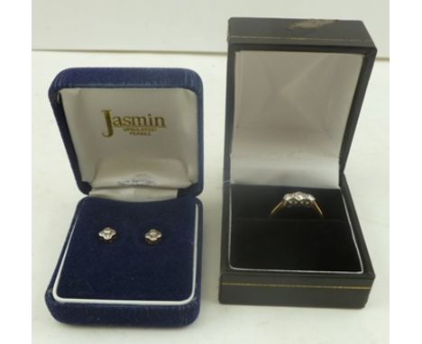 A THREE STONE DIAMOND RING having brilliant cut stones, on an 18ct gold band, ring size K and half, together with a PAIR OF D