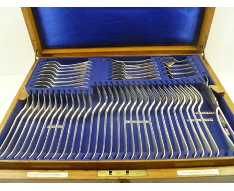 GOLDSMITHS AND SILVERSMITHS COMPANY AN A1 SILVER-PLATED CANTEEN OF CUTLERY, the oak box with brass carrying handles, interior