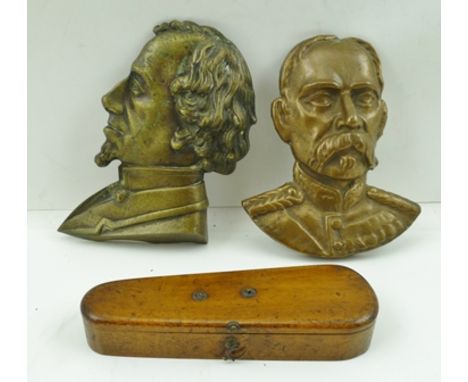  A 19TH CENTURY PART SET OF DOMINOES in a mahogany violin case shaped box, 15cm, together with TWO BRASS PORTRAIT PANELS, Dis