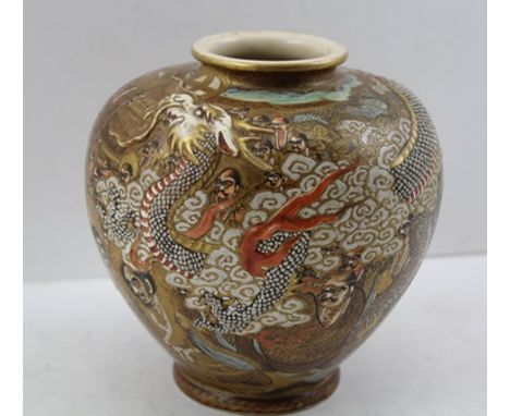 A JAPANESE SATSUMA EARTHENWARE VASE with raised dragon shoulders, painted and gilded with figures in the round, character mar