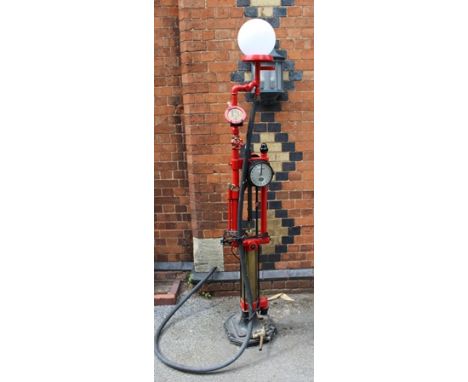 A GILBERT AND BARKER MODEL E245 SKELETON PETROL PUMP with price plaque, spherical opaque globe and brass nozzle, standing app