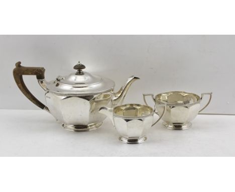 HARRISON BROTHERS AND HOWSON A THREE-PIECE SILVER TEA SET comprising; teapot, milk jug and two-handled sugar bowl, of octagon