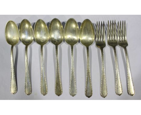 A small assortment of silver flatware including three forks and six spoons, all by the 'International Sterling' company and i