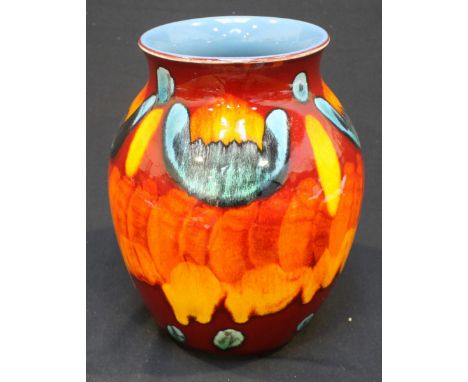 A Poole Pottery Delphis vase, the outside decorated with a red, blue and orange abstract design, painted blue inside, 20cm hi