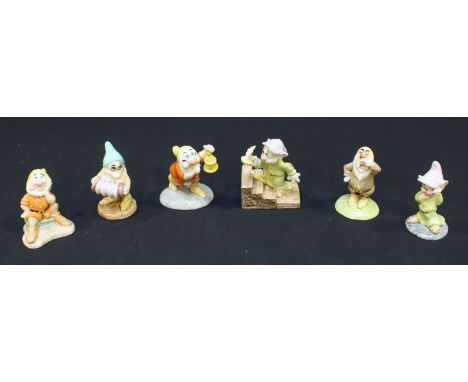 A collection of 6 Royal Doulton Snow White and the Dwarf Disney figures, including: Doc, Doc with lantern, Bashful's Melody, 