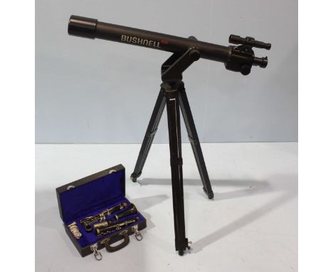 A Bushnell 450 telescope with adjustable folding tripod stand, together with a 'Sapphire' clarinet in lined vinyl case. (2)