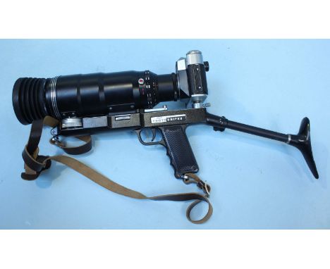 A Zenit ES photo sniper camera, complete with tools, UV lense cover and spare Helios-44-2 lense, in original metal carry case