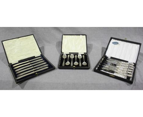 Two cased sets of early 20th century silver-handled tea knives and cased set of six silver tea spoons, Sheffield, 1936. (3)